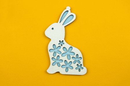 Easter bunny decoration, flat wooden toy background photo