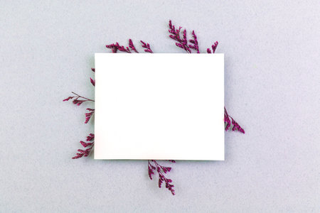 Creative flower mockup with blank invitation card, concept of flat lay background, with copy spaceの写真素材