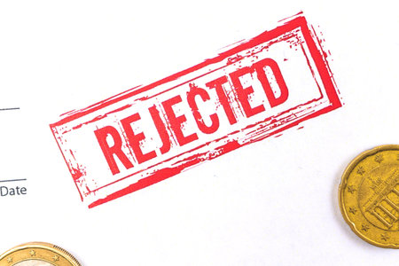 Official application with rejected stamp on it close-up