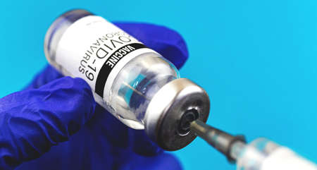 Coronavirus prevention concept, COVID-19 vaccine vial with syringe, injection photoの写真素材