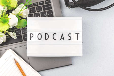 Podcast background, broadcasting flat lay, concept with technical equipment, office table with headphonesの写真素材