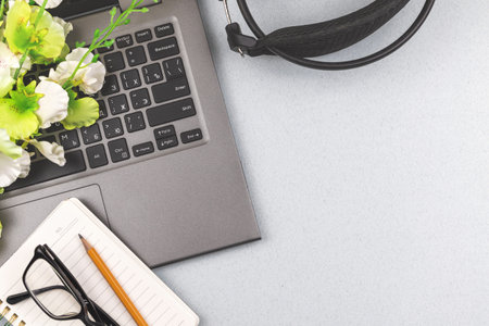 Broadcast and podcast flat lay background, laptop with headphones on the officw table, copy space photoの写真素材