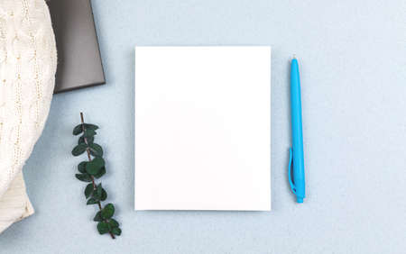 Flat lay business office desktop background with mockup, blank white card with copy space, top view photoの写真素材
