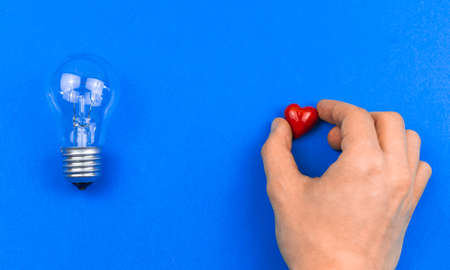 Two opinions love or intelligence, be smart or fell in love concept, background, young man need to chooseの写真素材