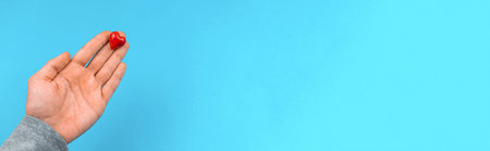 Donation and charity concept banner, hand holding red heart, health and help background photo