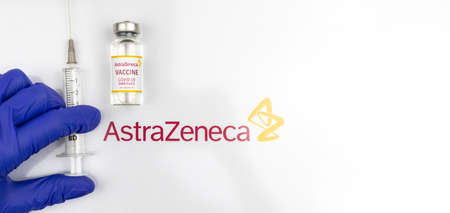 Kharkov, Ukraine - April 18, 2021: Doctor use AstraZeneca COVID-19 vaccine with syringe, vaccination concept banner photoのeditorial素材