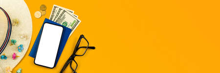 Travel and summer holiday vacation flat lay banner with mockup screen of mobile phone, straw hat and money on colorful background, copy spaceの写真素材