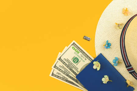 Passport, money and straw hat, travel flat lay background, summer vacation concept with copy space, top viewの写真素材