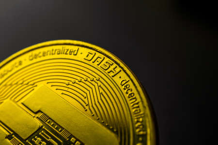 Golden Dash coin on black background, macro photography and business and finance concept, copy space photoの写真素材