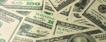 Banner a pile of one hundred US banknotes, cash of hundred dollar bills, dollar background
