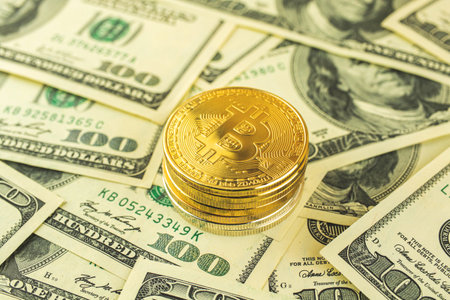 Bitcoin and dollar exchange background, golden crypto currency coins, business and financial concept photoの写真素材