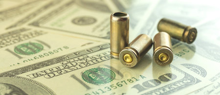 Banner criminal money with dollar and bullets for gun, 9mm pistol cartdridge on glass table with...
