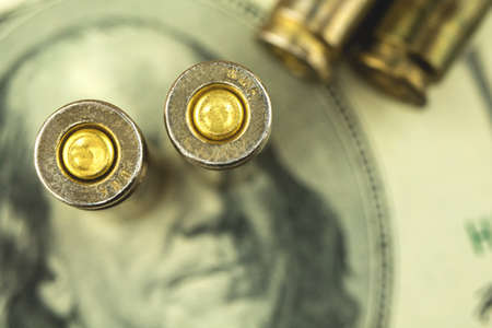 Bullet bottom closeup, criminal and dity money concept, financial corruption background photoの写真素材