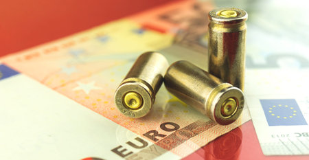 Bullet and euro money, banknotes, finance and security background