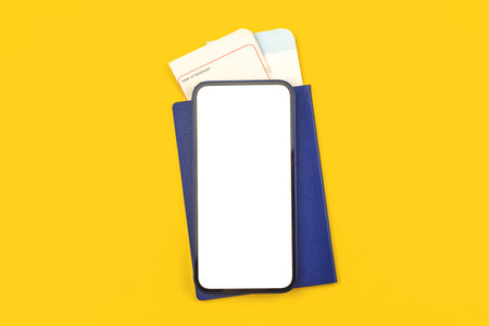 Boarding pass with passport and smartphone mockup blank white screen with copy space, yellow office...