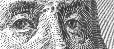 Banner Benjamin Franklin's face on the US one hundred dollar bill, close-up photo