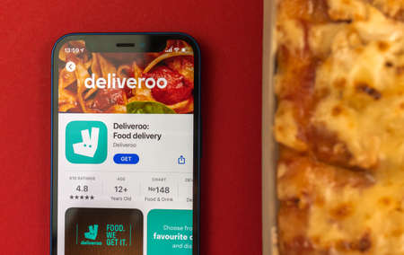 Kharkov, Ukraine - May 28, 2021: Deliveroo app icon and logo close-up displayed on Apple iPhone 12 screenのeditorial素材
