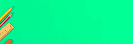 Education banner with school pencils and wooden ruler on a green desktop with copy space, top viewの写真素材