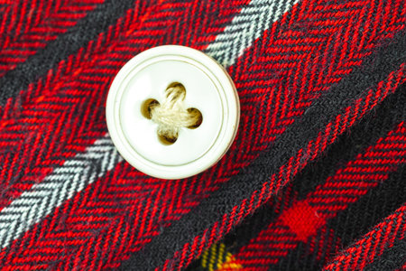 Button on the red shirt clouse texture background