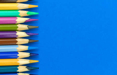 School pencils border composition, office blue table with copy space, top viewの写真素材