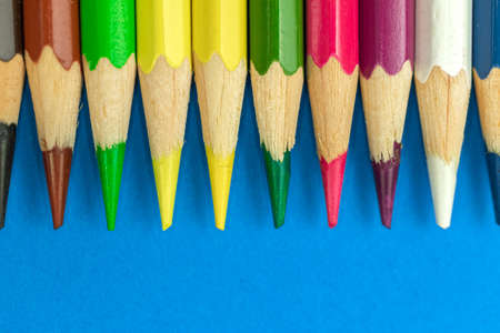 Close-up to sharp color pencils, macro photography, blue backgroundの写真素材