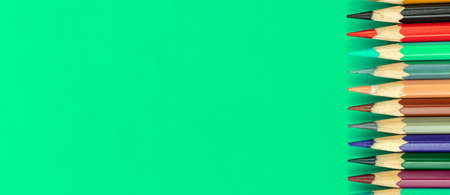 Color pencils long banner composition with copy space, sharp school pencils on a desktop, top viewの写真素材