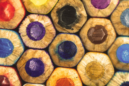 Close-up tips of the colorful drawing pencils, macro photo of the art eqipment, concept