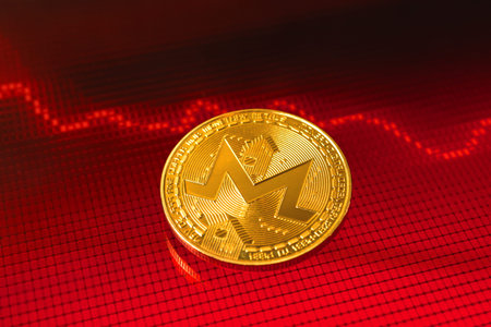 Fall of Monero cost and value price, cryptocurrency crisis concept, red down arrow and stock chart...