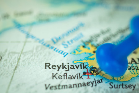 Location Reykjavik in Iceland, push pin on map closeup, marker of destination for travel, tourism...