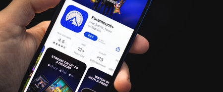 Kharkov, Ukraine - June 4, 2021: Paramount plus app, man holds mobile phone with application on the...