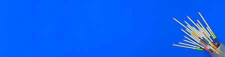 Set of color pencils in organizer. Wide banner with blue background. Copy space photoの写真素材