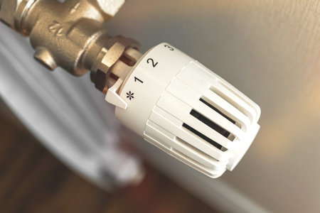 Heating radiator thermostat indoors close-up photo