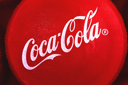 Kharkov, Ukraine - March 24, 2021: Coca-cola logo on the cap close up