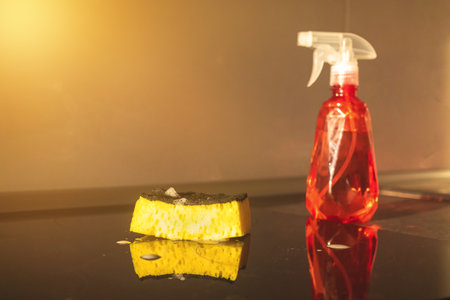 Kitchen cleaning concept, spray bottle and sponge on tabletopの写真素材