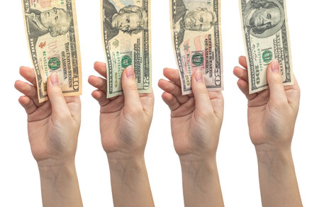 Collage hand holding US dollar banknotes isolated on a white background. Woman give and pay in dollar bill conceptの写真素材