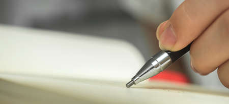 Hand hold pencils and draws or writing in notebook, artist hobby banner background with copy spaceの写真素材