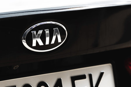 Kharkov, Ukraine - September 13, 2021: KIA brand logo on a black car background, emblem, symbol...