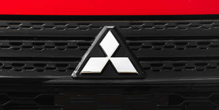Kharkov, Ukraine - September 13, 2021: Mitsubishi japan car logo and emblem on red car close-upのeditorial素材