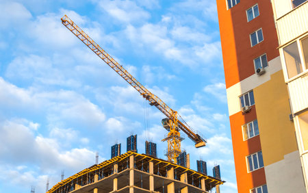 Construction and building, construction crane on a sky background photo