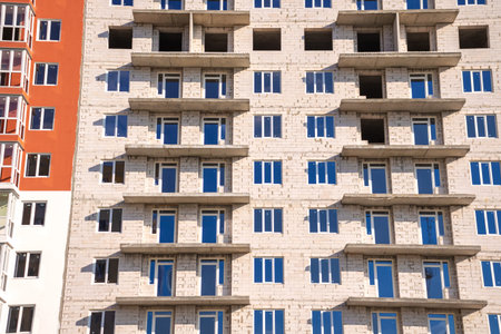 Construction site of new residential building, real estate industry background. Urban architecture,...