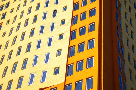 Multi-storey high-rise building with many glass windows. Urban real estate stock