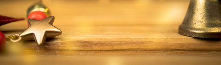 Banner, empty wooden table with christmas decoration. Golden sparkles and bokeh on background....