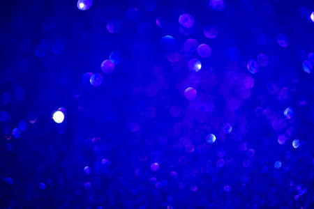 Indigo blue bokeh background. Vintage glitter lights, glowing effects backdrop