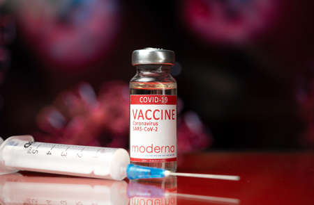 Kharkov, Ukraine - November 3, 2021: Moderna vaccine and medical syringe, COVID-19 Coronavirus vaccination background photoのeditorial素材