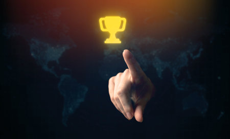 Leadership successful achievement with goal and objective target. World win concept. Hand and trophy on a black background photoの写真素材