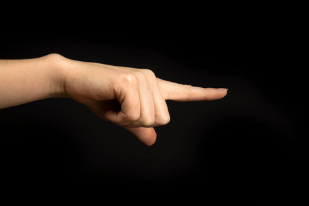 Hand points to something. Woman hand gesture, pointing sign, gesture look at this, pay attention....