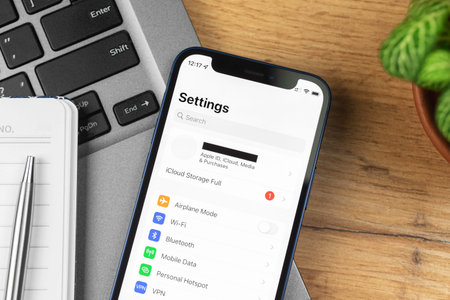 Kharkov, Ukraine - November 21, 2021: Close-up settings screen on Apple iPhone. Business workspace,...