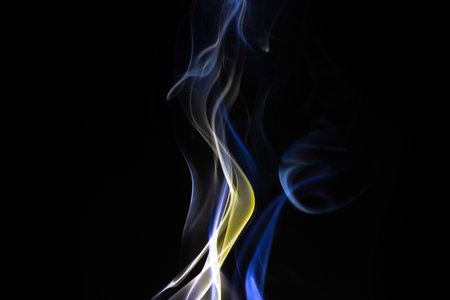 Abstract candle smoke flow on a black background. Colored fog textureの写真素材