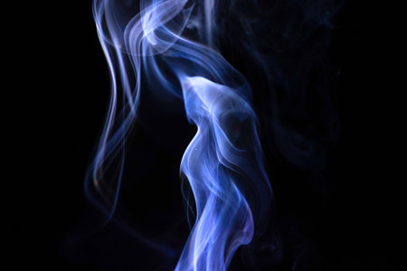 Abstract blue smoke on a black backgroundの写真素材