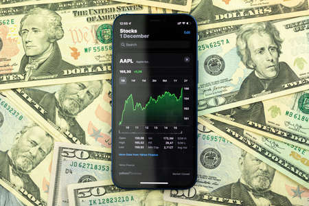 Kharkov, Ukraine - December 1, 2021: Apple stock trading concept. Business, investment in the company background photoのeditorial素材